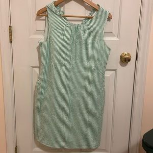 Green and white seersucker sundress ruffles in back. It has pockets! Size 8.
